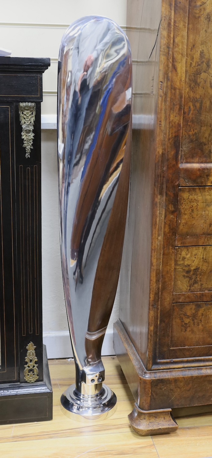 A polished aluminium aircraft propeller